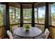 Covered outdoor seating area overlooking a tranquil lake, perfect for relaxing and enjoying nature's beauty at 127 Blue Heron Pond Rd # C, Kiawah Island, SC 29455