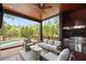 An outdoor seating area boasts a grill, ceiling fan, comfortable seating and scenic views at 127 Blue Heron Pond Rd # C, Kiawah Island, SC 29455