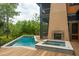 Backyard with private pool, spa, fireplace and screened in porch on a multi-level deck at 127 Blue Heron Pond Rd # C, Kiawah Island, SC 29455