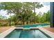 A tranquil pool overlooking a beautiful natural landscape with trees and a lake at 127 Blue Heron Pond Rd # C, Kiawah Island, SC 29455
