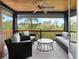 Outdoor porch with comfortable seating, wood ceiling, and scenic views of the surrounding landscape at 127 Blue Heron Pond Rd # C, Kiawah Island, SC 29455