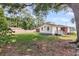 Backyard of home, displaying expansive green lawn and mature trees for shade at 127 Roberts Rd, Summerville, SC 29483