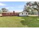 A view of the back exterior of the house and part of the backyard at 127 Roberts Rd, Summerville, SC 29483