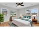 Comfortable bedroom featuring large windows, white furniture, hardwood floors and stylish decor at 127 Roberts Rd, Summerville, SC 29483