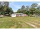 Well-manicured lawn surrounds this cozy brick home featuring an attached garage and inviting porch at 127 Roberts Rd, Summerville, SC 29483