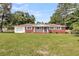 Attractive brick house with a white trim, well-kept lawn, and attached garage at 127 Roberts Rd, Summerville, SC 29483