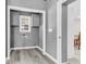 Laundry area with washer/dryer hookups, storage cabinets, and neutral paint at 127 Roberts Rd, Summerville, SC 29483