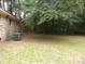 Large backyard featuring well-maintained lawn and AC unit, perfect for outdoor activities and relaxation at 1277 Russellville Rd, Saint Stephen, SC 29479