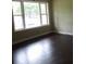 Inviting bedroom with a large window providing plenty of natural light and vinyl flooring at 1277 Russellville Rd, Saint Stephen, SC 29479