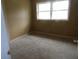 Cozy bedroom featuring neutral carpet, bright window, and ample space for comfort and relaxation at 1277 Russellville Rd, Saint Stephen, SC 29479