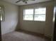 Comfortable bedroom featuring neutral carpet and large windows, creating a serene retreat at 1277 Russellville Rd, Saint Stephen, SC 29479