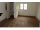 Bright bedroom featuring vinyl flooring, a window, and a view into the bathroom at 1277 Russellville Rd, Saint Stephen, SC 29479