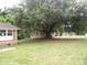 Spacious front yard with mature tree offering ample shade for a charming home and outbuilding at 1277 Russellville Rd, Saint Stephen, SC 29479