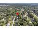 An aerial view shows the surrounding neighborhoods with mature trees at 1391 Fairfield Ave, Charleston, SC 29407