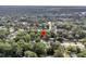 A serene aerial view showcases a neighborhood surrounded by lush green trees at 1391 Fairfield Ave, Charleston, SC 29407