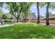 Lush backyard with a shed, patio seating area, and a wooden fence at 1391 Fairfield Ave, Charleston, SC 29407