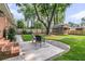 Spacious backyard with well-maintained lawn, patio, shed, and lush greenery at 1391 Fairfield Ave, Charleston, SC 29407