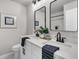 Stylish bathroom with double sinks, modern mirrors, and a separate toilet area at 1391 Fairfield Ave, Charleston, SC 29407