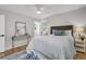 Well-lit bedroom featuring two windows, a large bed, modern decor and ample natural light at 1391 Fairfield Ave, Charleston, SC 29407