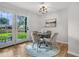 Cozy dining area with a round table, seating for four, and natural light at 1391 Fairfield Ave, Charleston, SC 29407