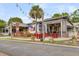 Charming outdoor seating area with colorful string lights at Triangle Char and Bar at 1391 Fairfield Ave, Charleston, SC 29407