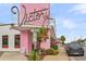 Unique restaurant with pink accents, outdoor seating, and convenient Zone P parking at 1391 Fairfield Ave, Charleston, SC 29407