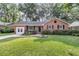 Charming brick home featuring a beautifully landscaped front yard and inviting entrance at 1391 Fairfield Ave, Charleston, SC 29407