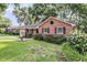 Lovely brick home featuring a circular window and attractive landscaping at 1391 Fairfield Ave, Charleston, SC 29407
