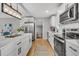 Kitchen view featuring stainless appliances, white cabinets, and island with seating at 1391 Fairfield Ave, Charleston, SC 29407