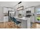 Bright kitchen featuring stainless steel appliances, white cabinets, and center island with seating at 1391 Fairfield Ave, Charleston, SC 29407
