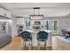 Bright kitchen featuring stainless steel appliances, white cabinets, and center island with breakfast bar at 1391 Fairfield Ave, Charleston, SC 29407