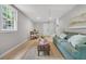 Living room featuring a sofa, coffee table, and natural lighting at 1391 Fairfield Ave, Charleston, SC 29407