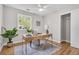Bright office space with a desk, hardwood floors, large window and potted plants at 1391 Fairfield Ave, Charleston, SC 29407