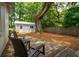 Relaxing backyard features a wood deck, outdoor seating, and privacy landscaping at 1408 Goblet Ave, Mount Pleasant, SC 29464