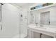 Bathroom with glass shower, white vanity, and large mirror providing natural light at 1408 Goblet Ave, Mount Pleasant, SC 29464