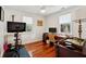 Sunlit home office features hardwood floors, white walls, and ample workspace at 1408 Goblet Ave, Mount Pleasant, SC 29464