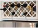 White wine rack display sitting above a stainless steel refrigerator at 1408 Goblet Ave, Mount Pleasant, SC 29464
