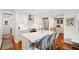 Bright kitchen boasts a white island with seating, stainless steel appliances, and hardwood floors at 1408 Goblet Ave, Mount Pleasant, SC 29464