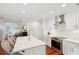 Island kitchen features white cabinets, stainless appliances, and seating at 1408 Goblet Ave, Mount Pleasant, SC 29464