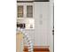 Kitchenette features white cabinets, stainless steel appliances, and glass display cabinets at 1408 Goblet Ave, Mount Pleasant, SC 29464