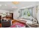 Inviting living room showcasing hardwood floors, a comfortable couch, and ample natural light at 1408 Goblet Ave, Mount Pleasant, SC 29464