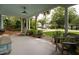 Inviting covered porch featuring stylish seating, potted plants, and a serene outdoor ambiance at 1408 Goblet Ave, Mount Pleasant, SC 29464
