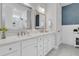 Bathroom features a double sink vanity with quartz counters and modern fixtures and mirrors at 1494 N Lakeshore Dr, Mount Pleasant, SC 29466