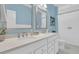 Bright bathroom with double sink vanity, quartz countertop, two framed mirrors, brushed nickel faucets, and white cabinets at 1494 N Lakeshore Dr, Mount Pleasant, SC 29466