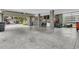 Spacious garage featuring concrete floors, exposed support beams, an open garage door, and shelving at 1494 N Lakeshore Dr, Mount Pleasant, SC 29466
