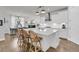Modern kitchen with white cabinets, stainless steel appliances, an island with bar stool seating and open concept at 1494 N Lakeshore Dr, Mount Pleasant, SC 29466