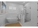 Luxurious bathroom featuring a soaking tub, a glass-enclosed shower, white subway tile and a neutral color palette at 1557 Kepley Dr, Mount Pleasant, SC 29464