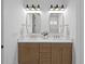 Beautiful bathroom featuring double sinks, white countertops, gold fixtures and hardware, and a neutral color palette at 1557 Kepley Dr, Mount Pleasant, SC 29464