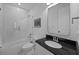Bathroom featuring a bathtub with shower, granite vanity, a toilet, black and white tile and a neutral color palette at 1557 Kepley Dr, Mount Pleasant, SC 29464