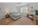Cozy bedroom with a bed, plaid wallpaper, two side tables, and natural light at 1557 Kepley Dr, Mount Pleasant, SC 29464